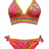 Bright pink bikini with tropical floral print, yellow lace trim, and ruffled edges; triangle top and side-tie bottoms.