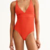 Bright coral one-piece swimsuit with a plunging V-neck and seam detailing at the waist.
