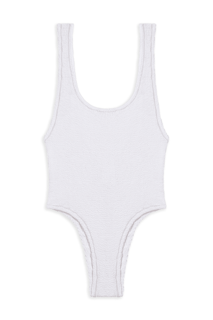 White textured one-piece swimsuit with high-cut legs and wide straps on a plain background