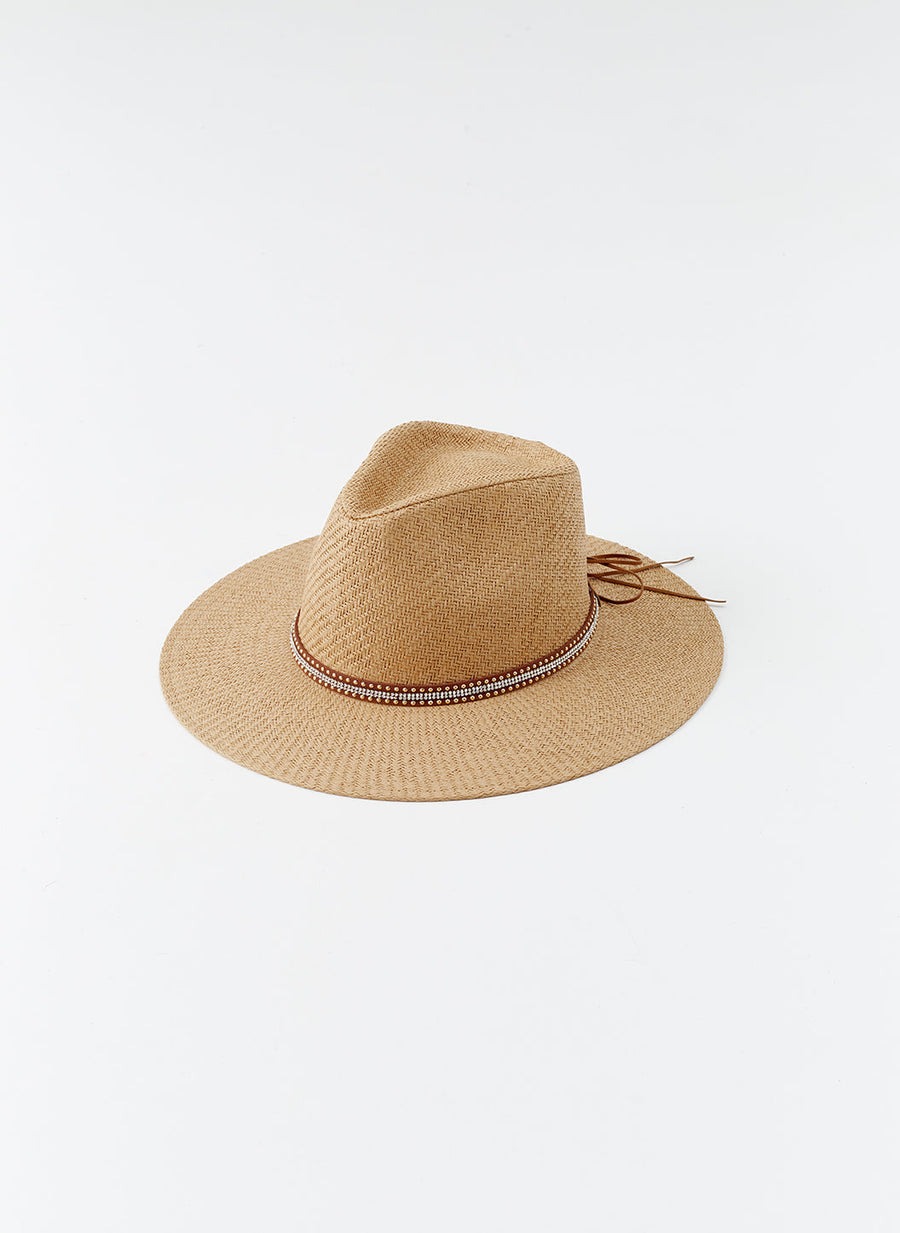 Straw sun hat with a brown beaded wraparound band on a white background.