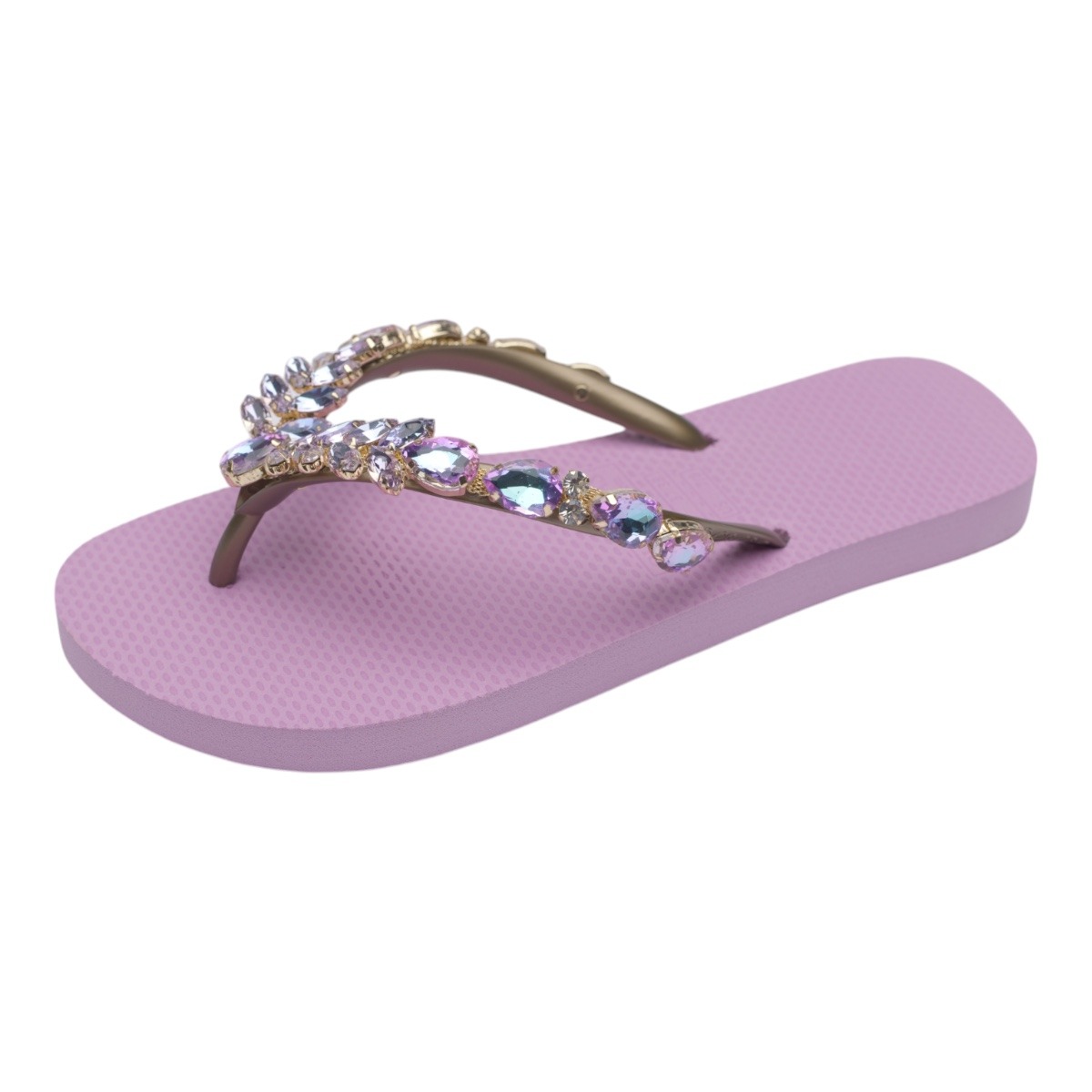 Pink flip-flop sandal with gem-studded straps on a light pink sole.