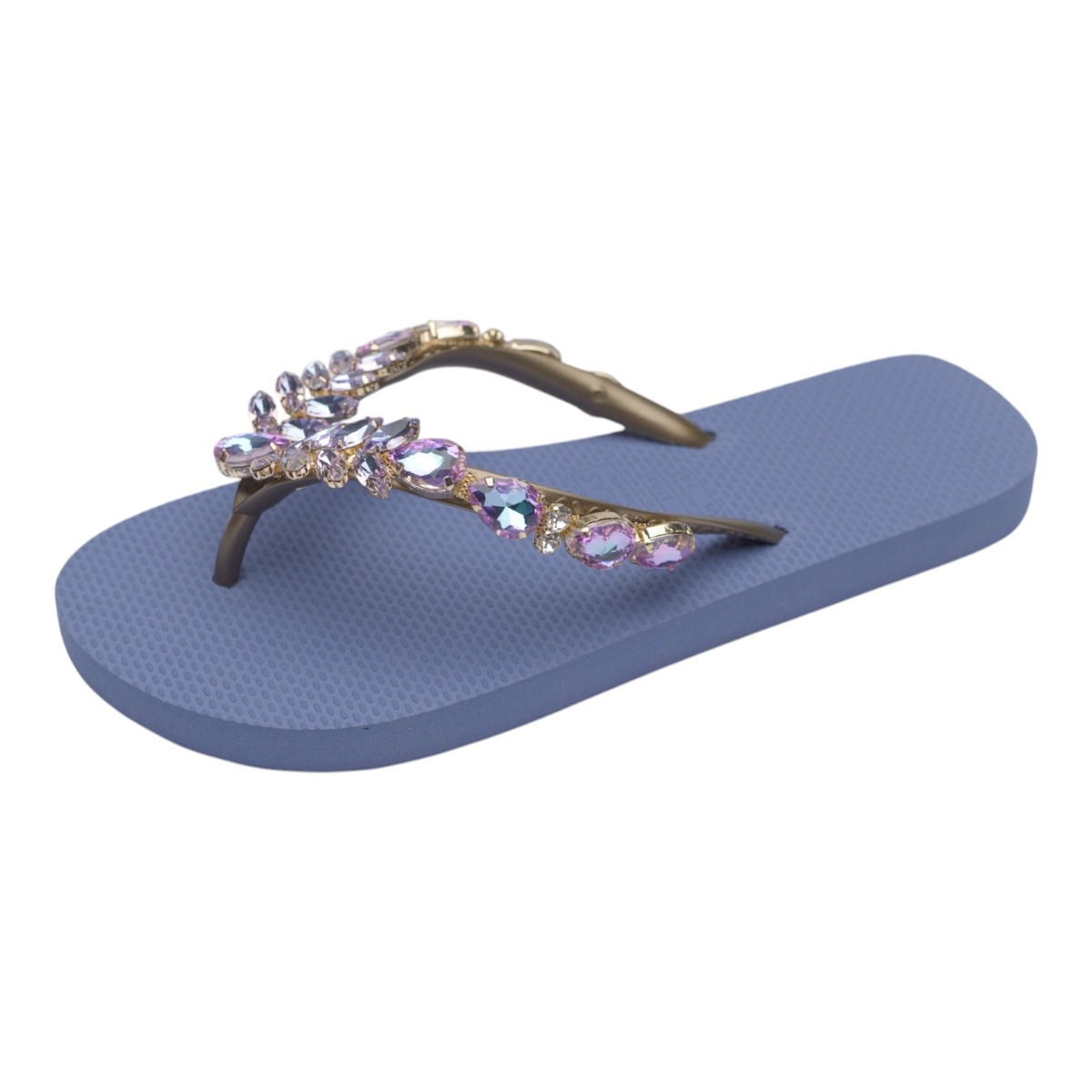Blue flip-flop featuring a crystal-studded strap with purple gems on a textured blue sole