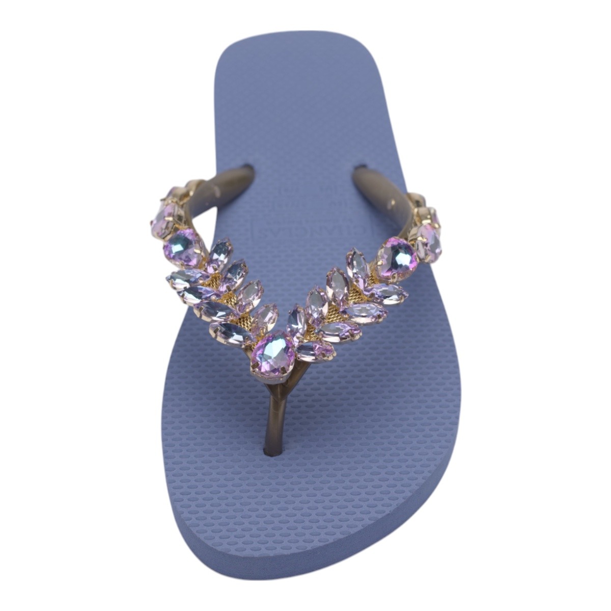 Blue flip-flop sandal with a jeweled pink/purple crystal-stone strap across the topinse