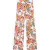 White wide-leg pants with a bright multicolor paisley and floral print on a white background.