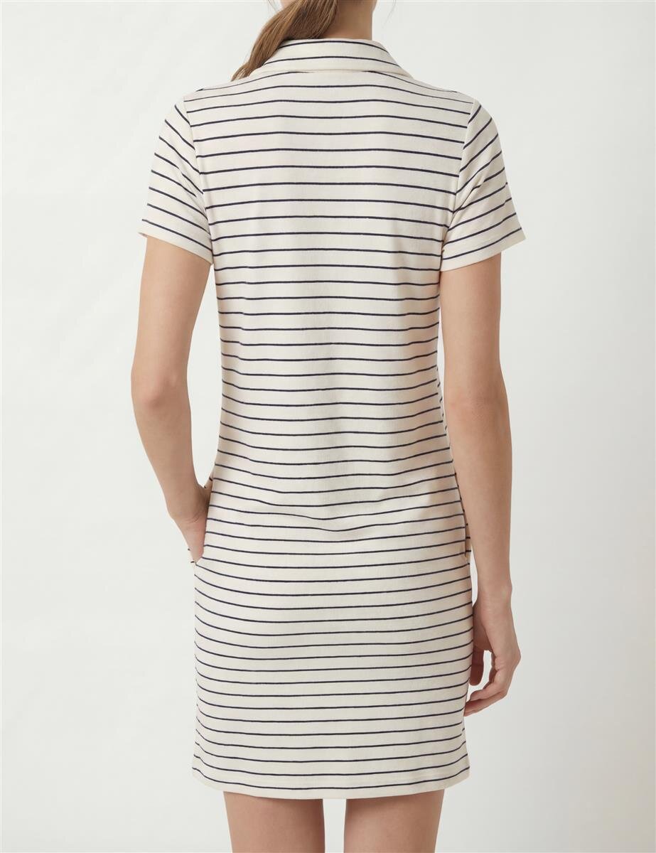 Back view of a person wearing a cream-colored short-sleeve dress with navy horizontal stripes, knee-length.