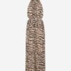 Tiger-print halter-neck maxi dress with a self-tabric belt at the waist and a gathered neckline, full-length flowing silhouette.